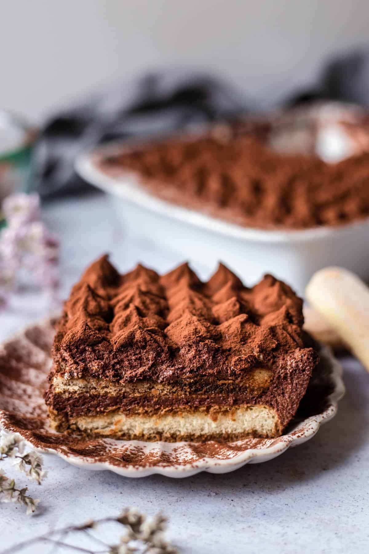 side image of a slice of easy chocolate tiramisu on a plate.