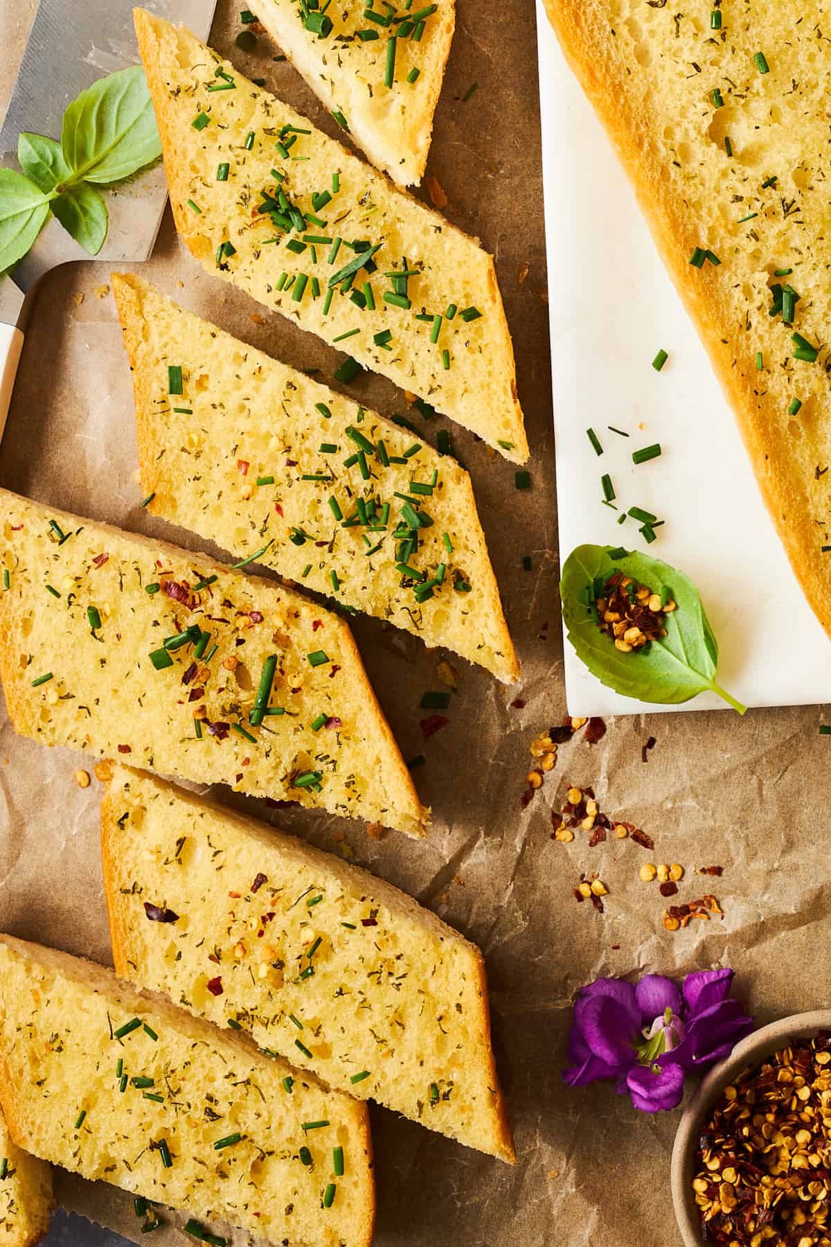 Simple garlic bread slices topped with parsley.