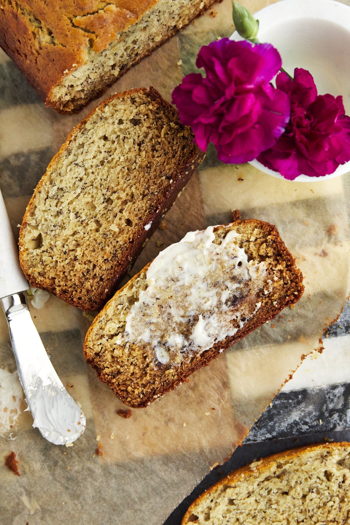 slices of banana bread with one topped with butter