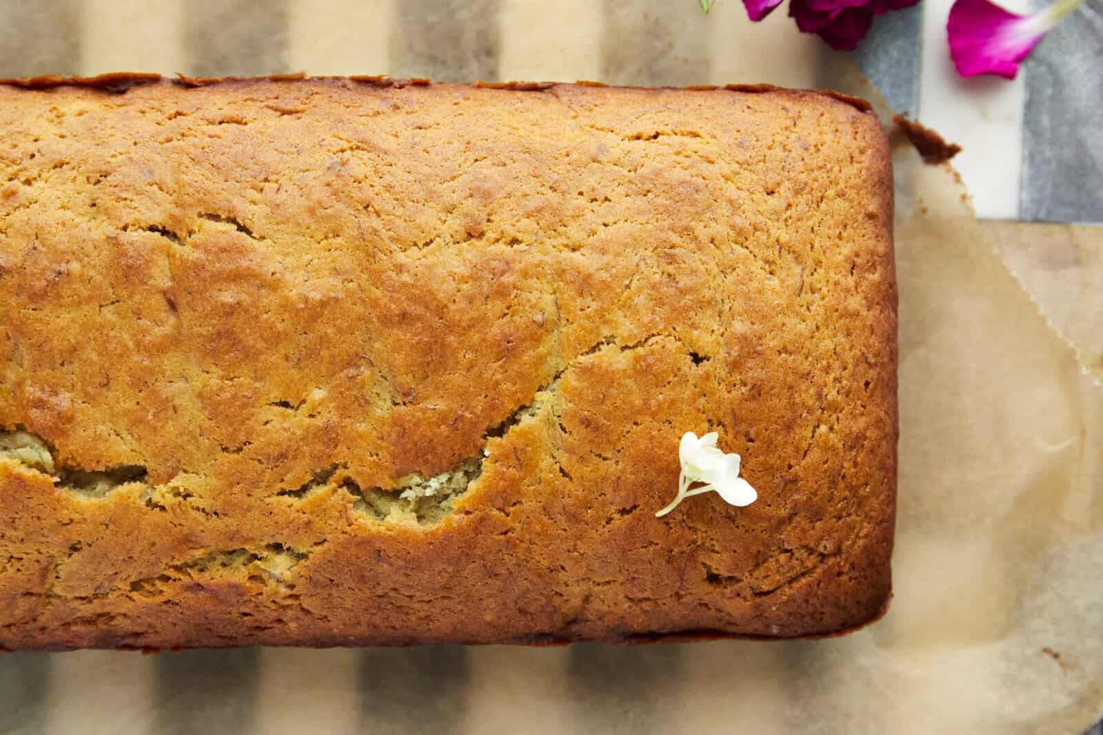 overhead image of a loaf of baked banana bread