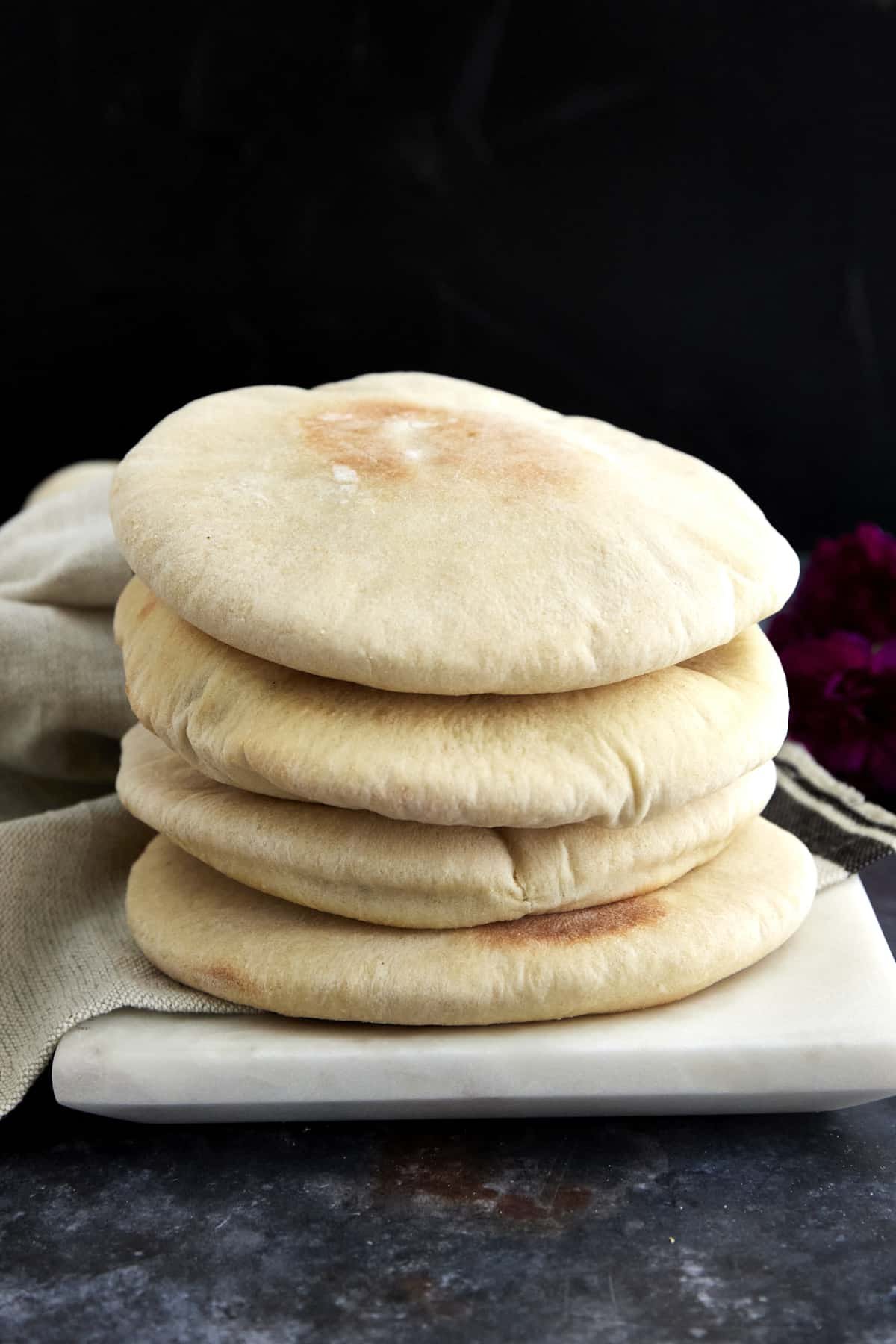 a stack of fluffy white pita bread.