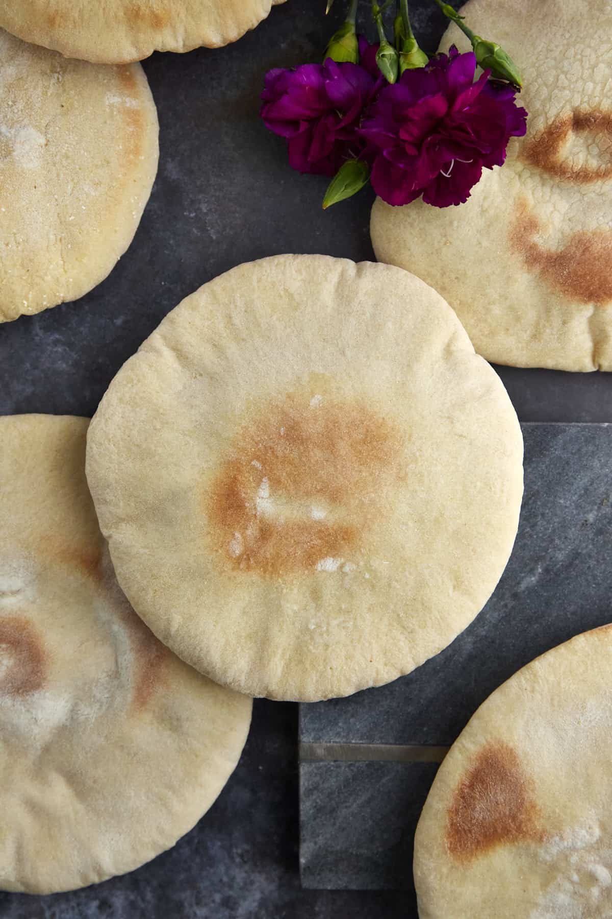 overhead image of white pita bread pockets.
