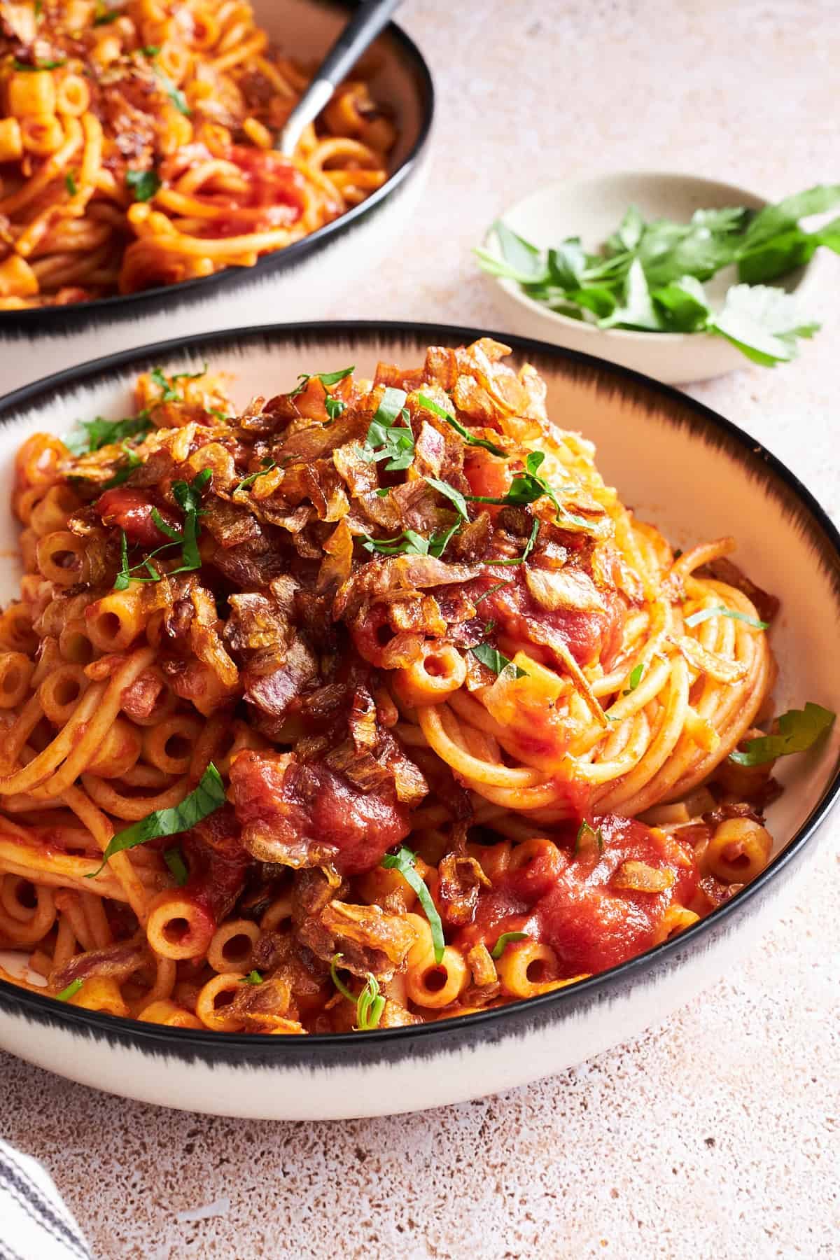 Two bowls of koshary Egyptian pasta.