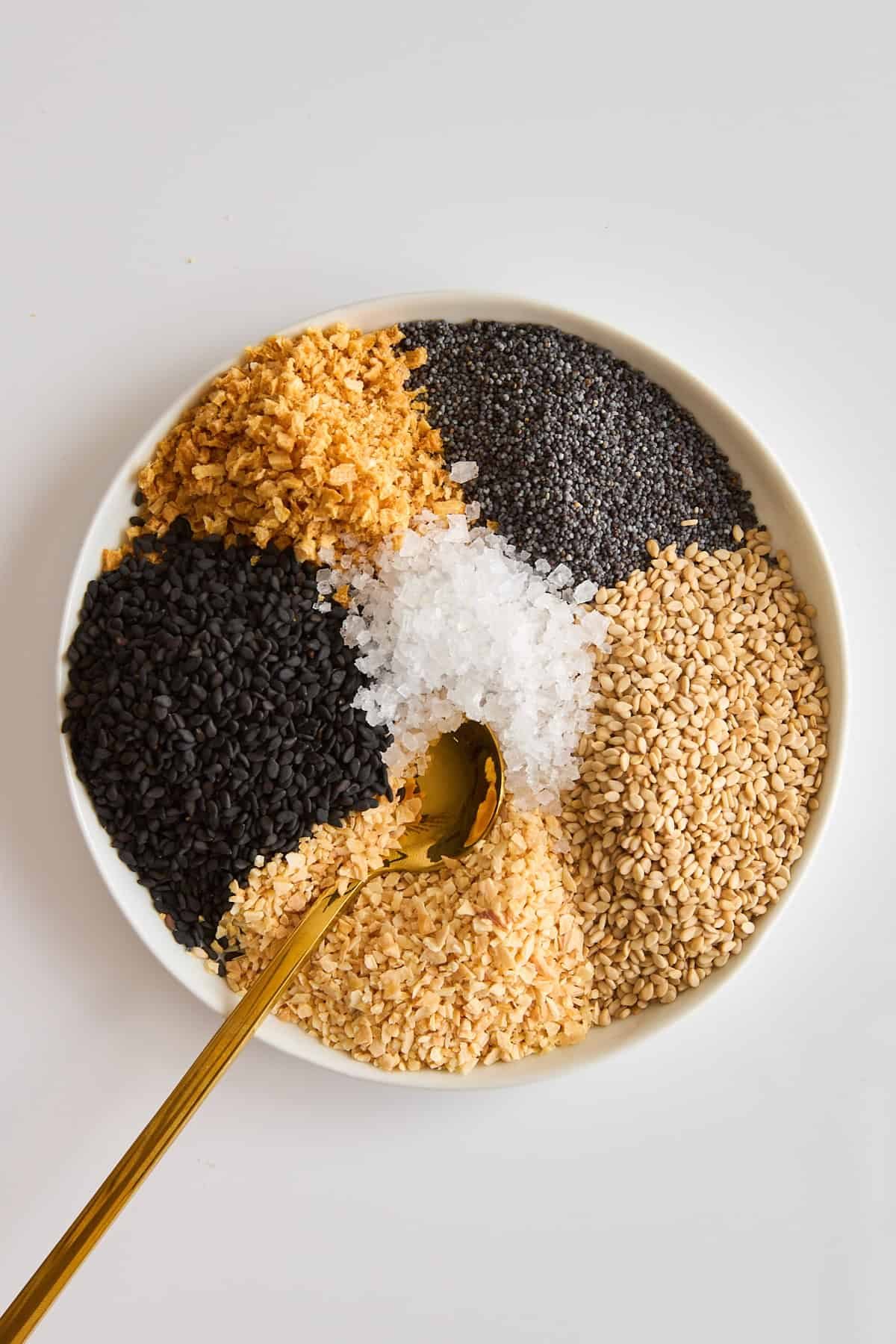 Ingredients for everything but the bagel seasoning ingredients in a bowl.