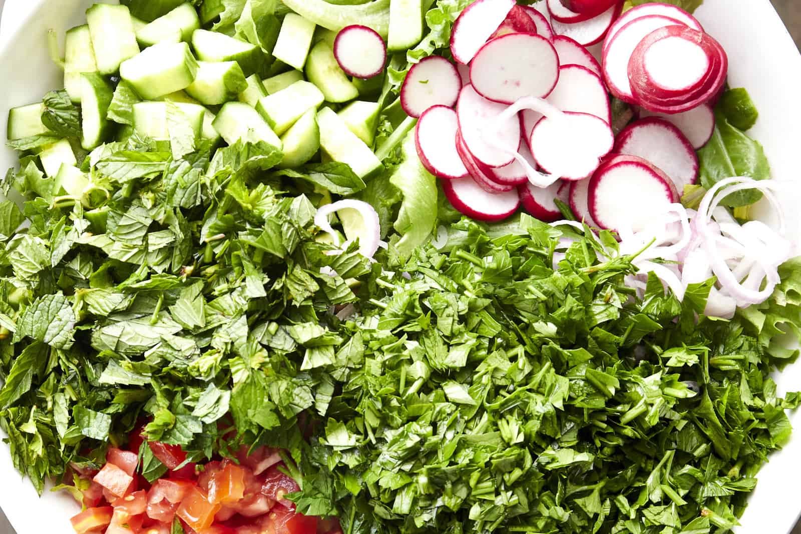 A bowl of veggies to make a fattoush salad.