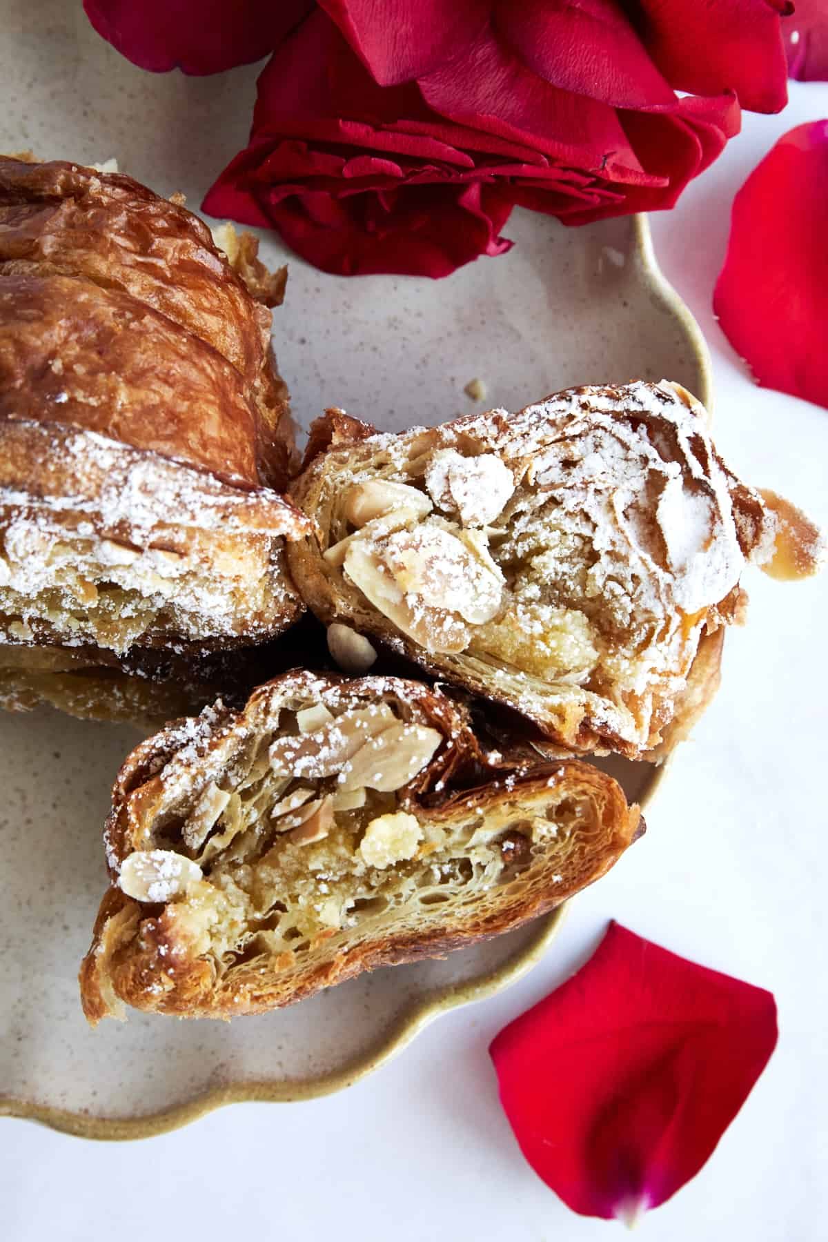Almond croissant French toast pieces on a plate.