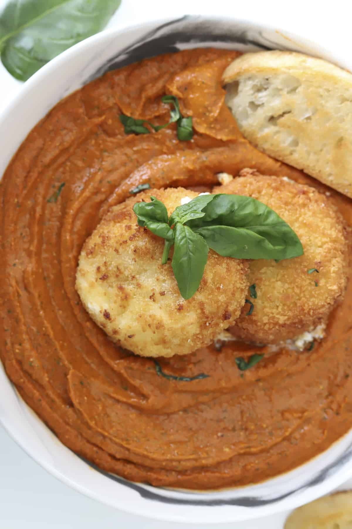 plated fried burrata with romesco sauce and baguette