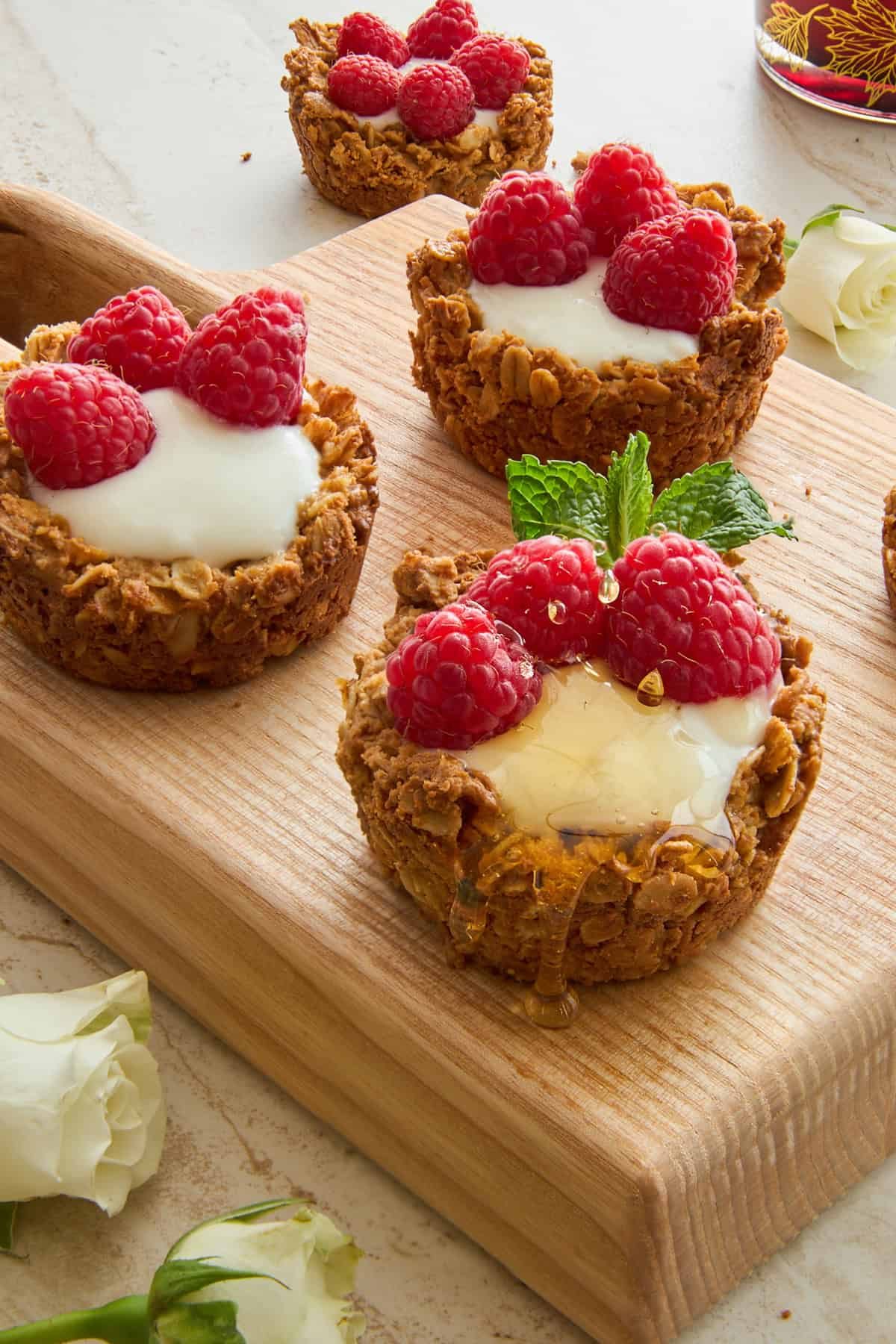 Granola cups full of yogurt and fresh berries.