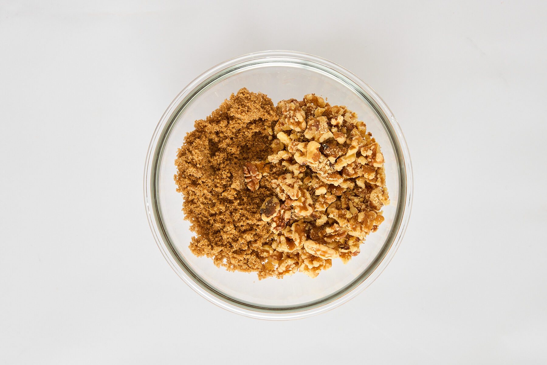 A brown sugar and walnut topping in a bowl.