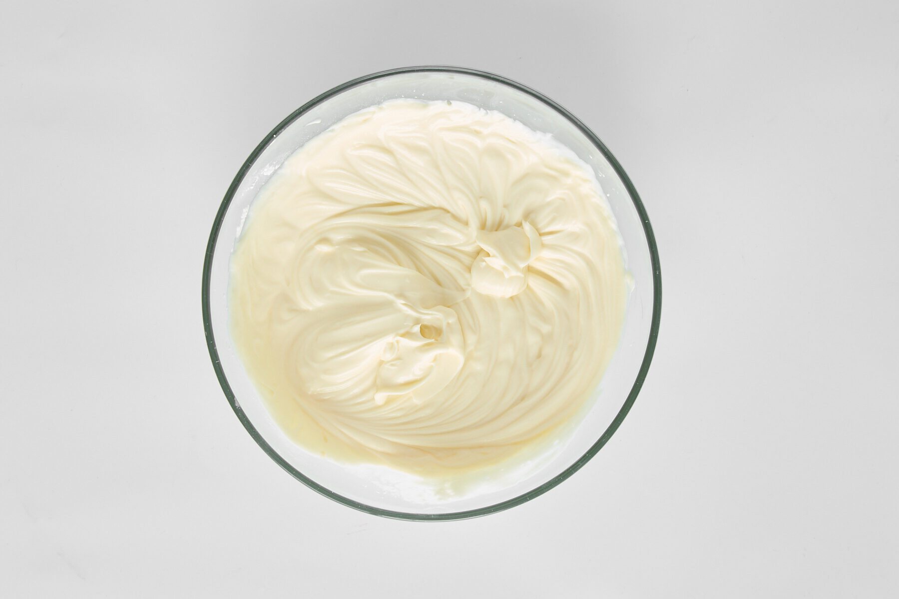 A bowl of blended mascarpone, Greek yogurt, and powdered sugar.