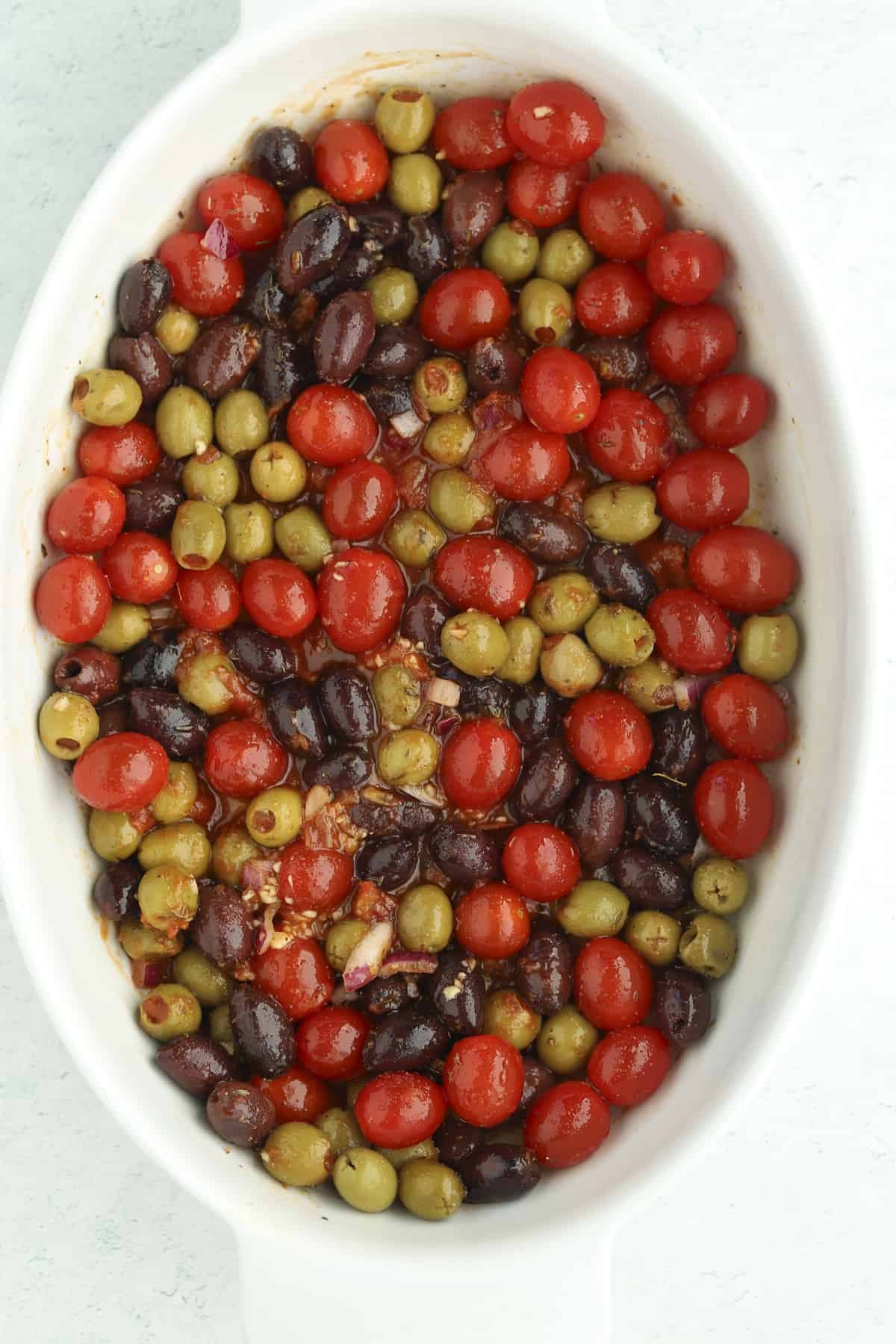overhead baking dish with tomatoes and olives