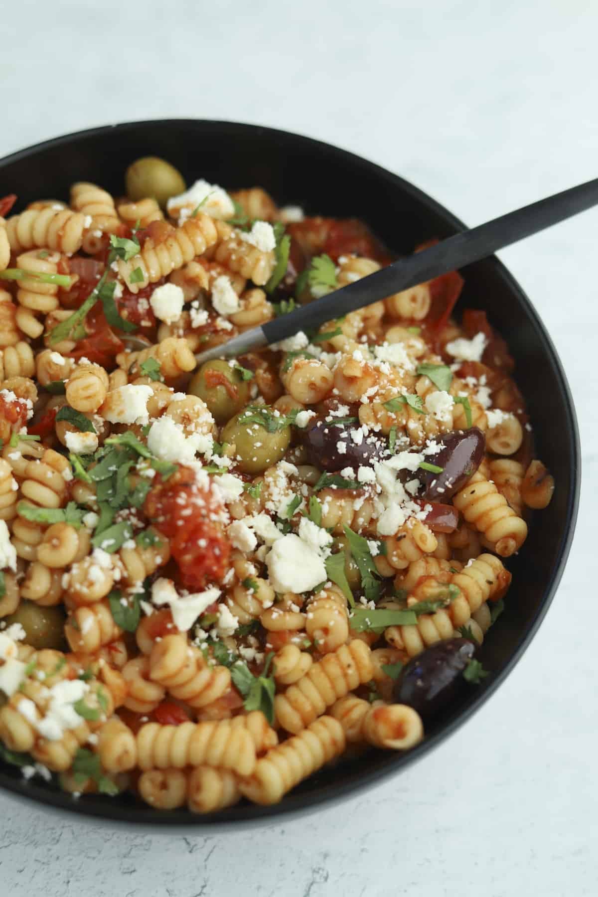 plated greek pasta bake with a fork