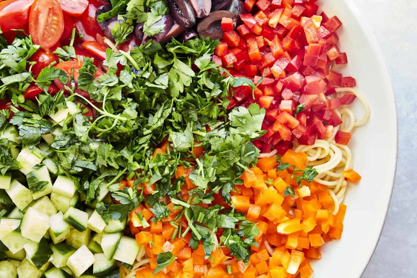 Untossed spaghetti pasta salad with veggies.
