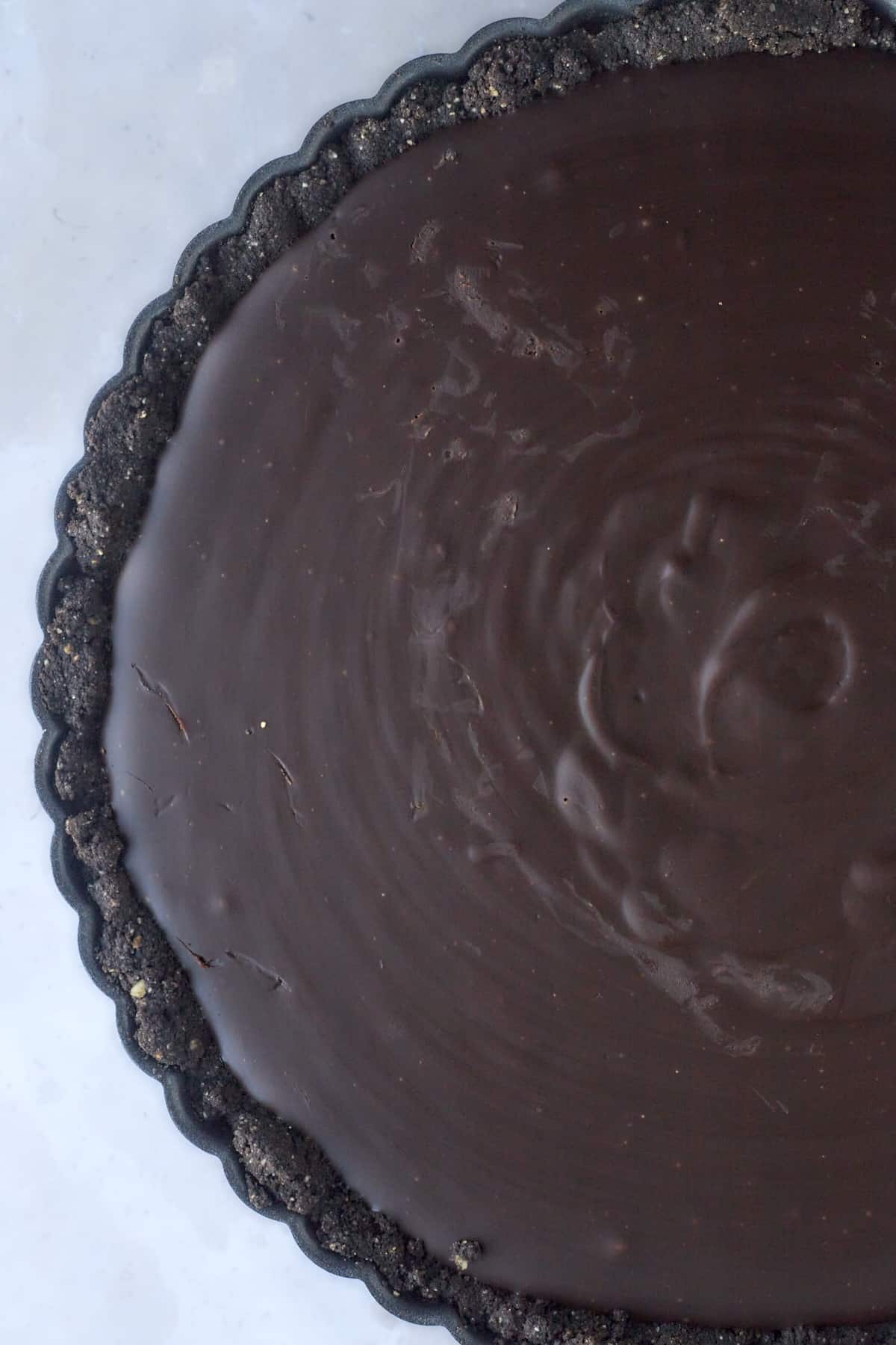 a tart with a chocolate crust and chocolate filling