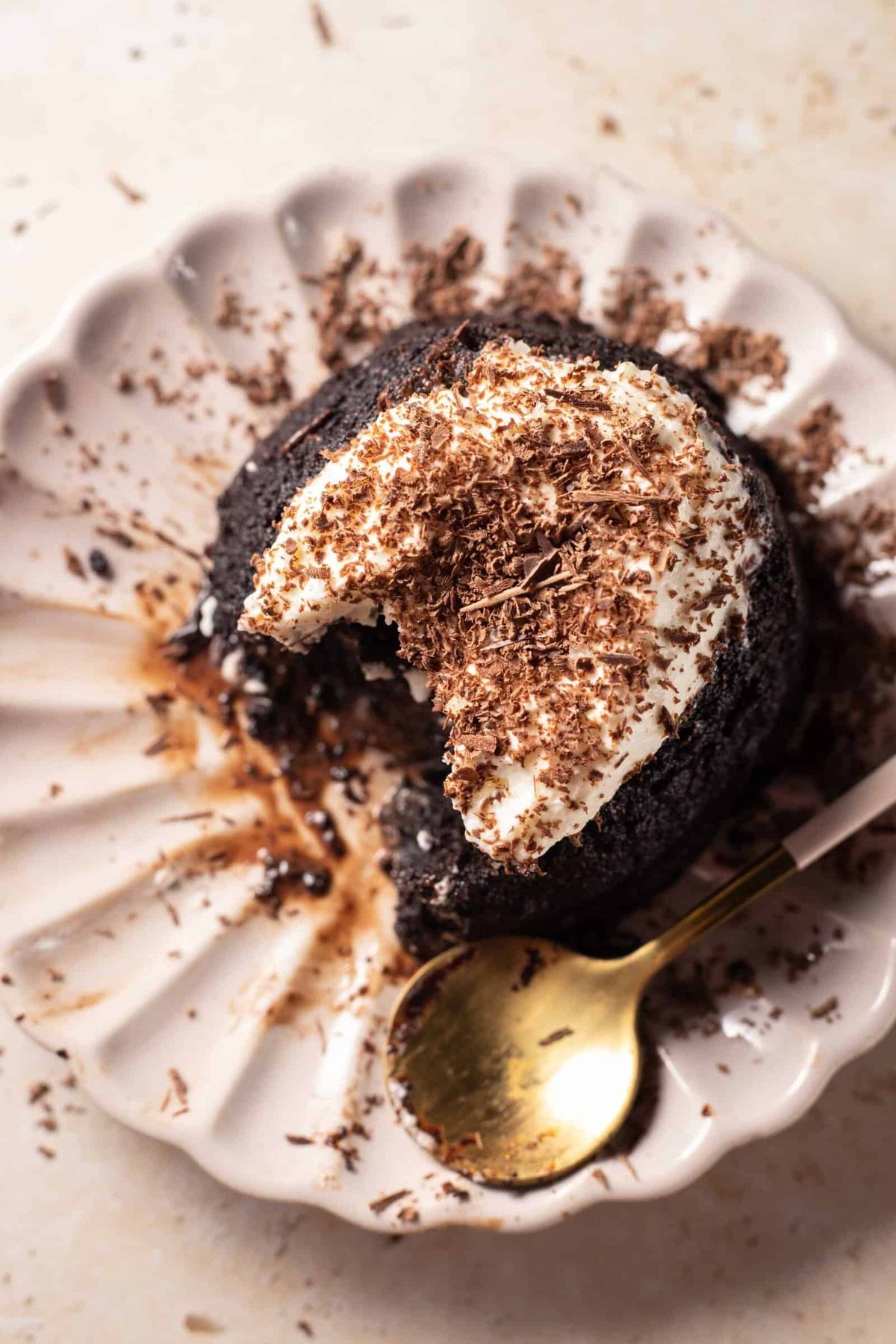 hazelnut chocolate lava cake on a plate with a bite missing