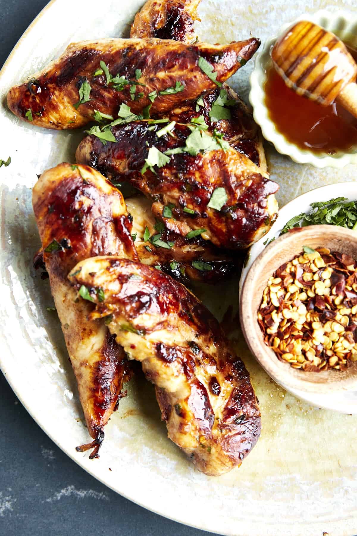 Grilled honey garlic chicken tenders topped with cilantro.