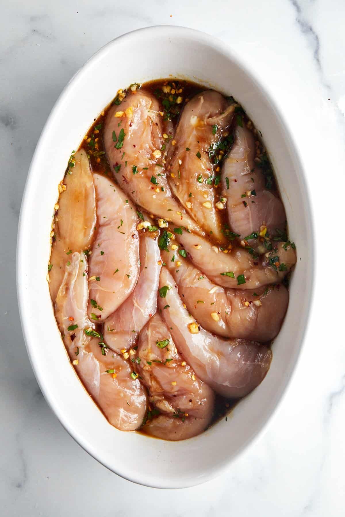 Chicken tenders marinating in honey garlic marinade.