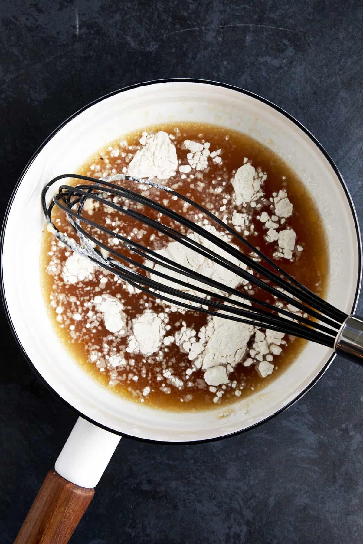 A roux being made with turkey drippings and flour.