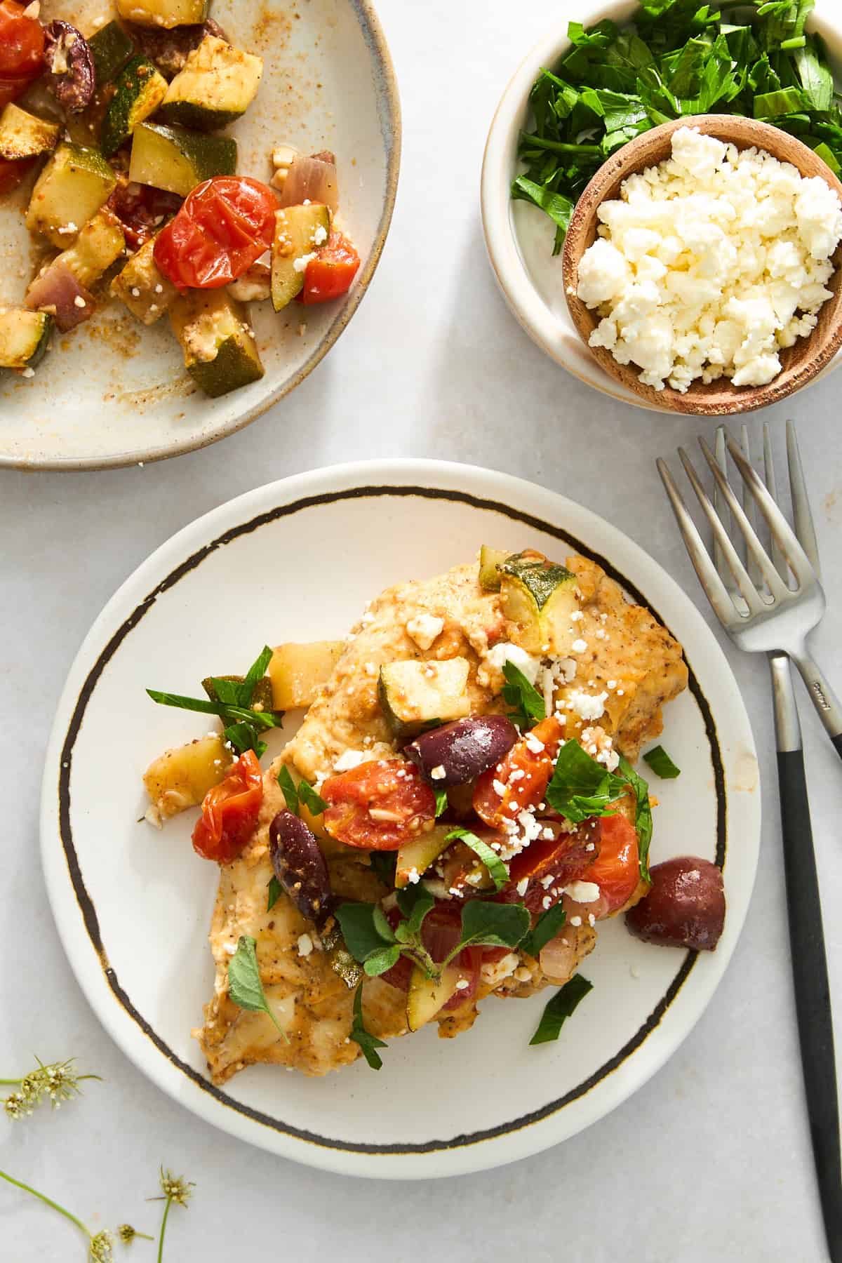 Hummus baked chicken on a plate.