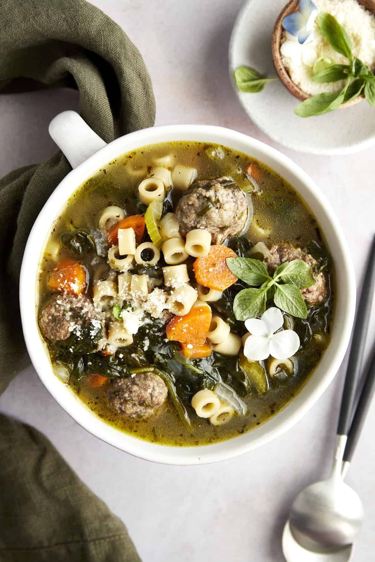 Overhead image of a bowl of Italian wedding soup.
