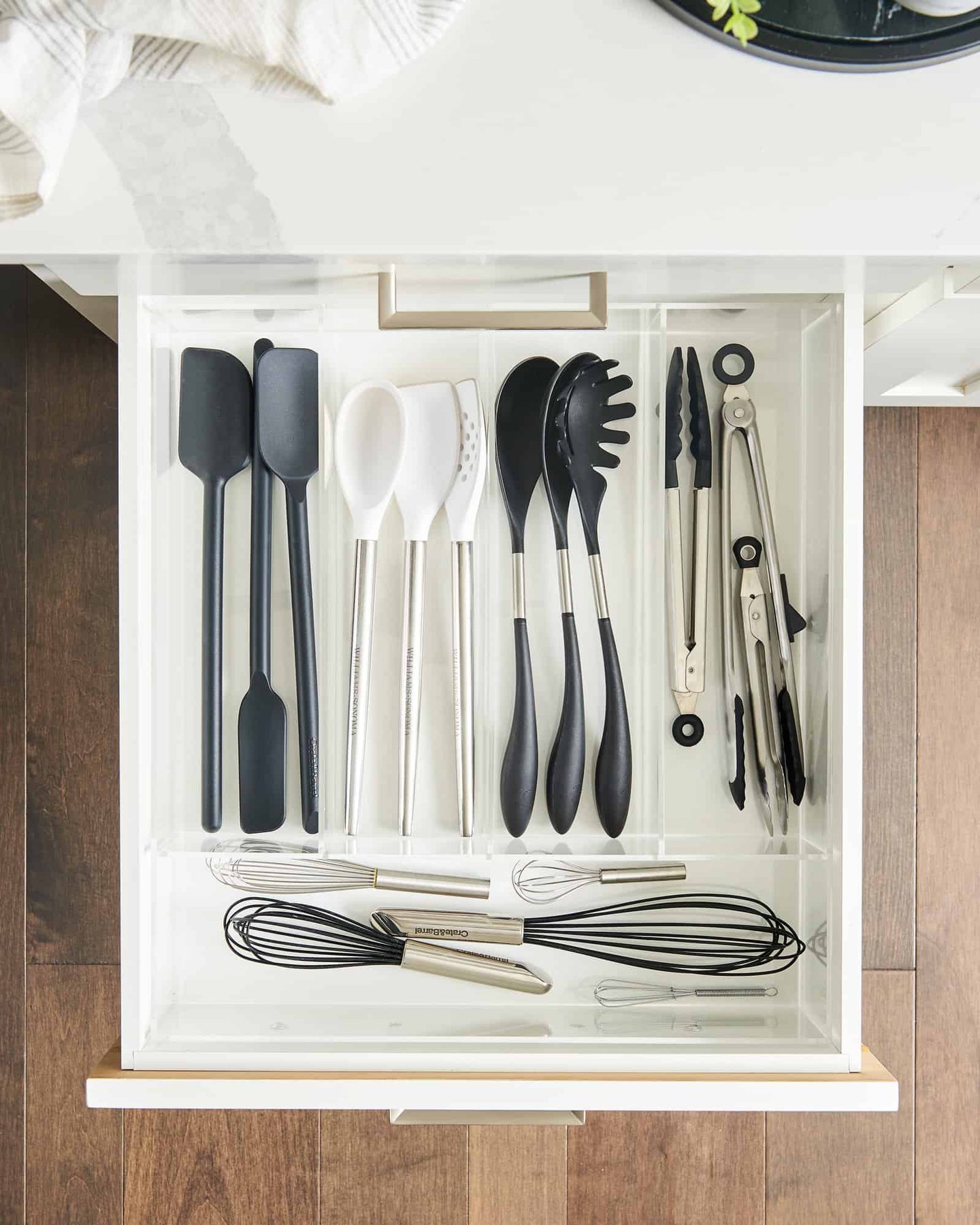 open drawer will kitchen tools in an organizer