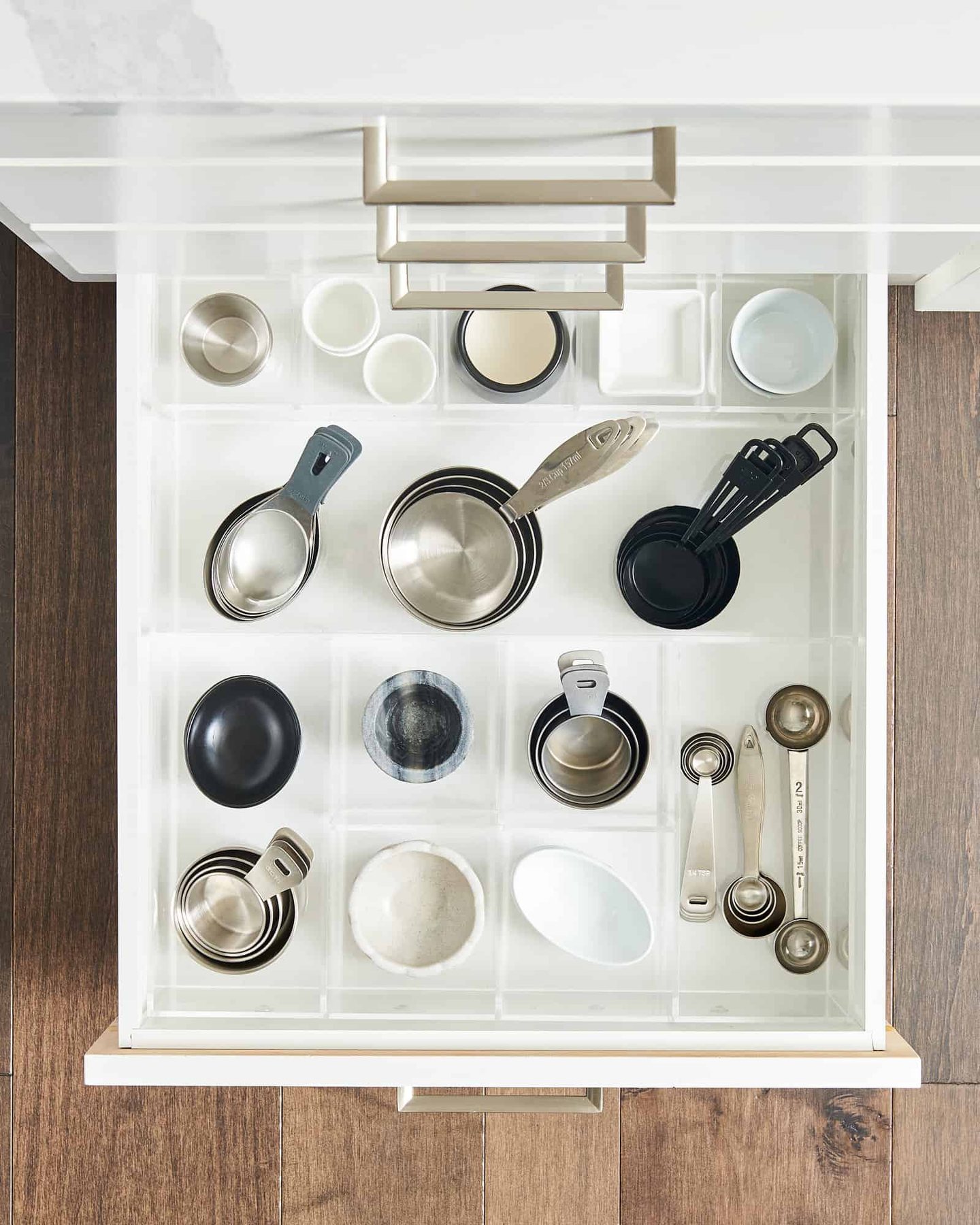 measuring cups and spoons in a drawer organizer