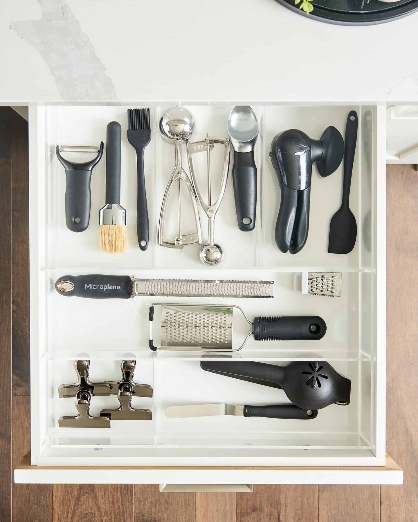 kitchen tools in an organizer in a drawer.