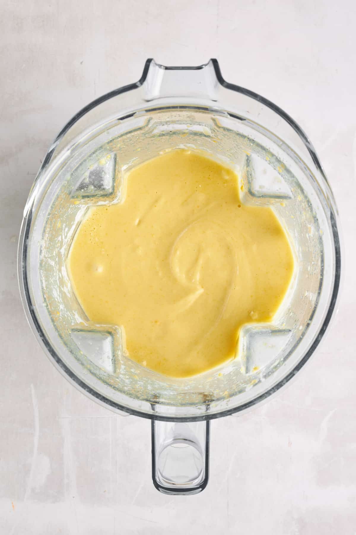 Orange cake batter in a blender.