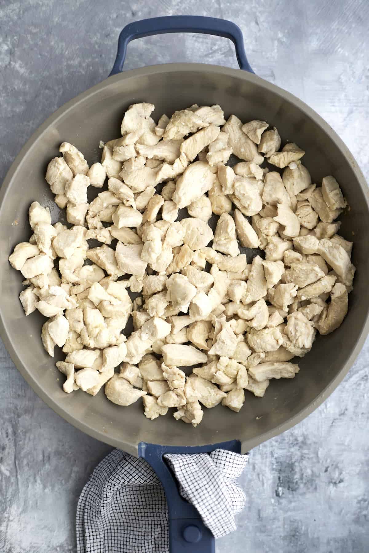 chicken pieces in a skillet