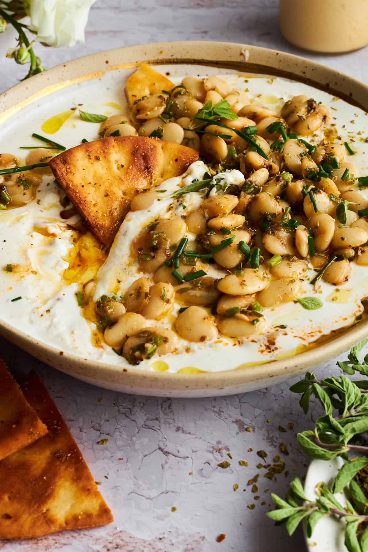 A bowl of marinated butter beans with cottage cheese.