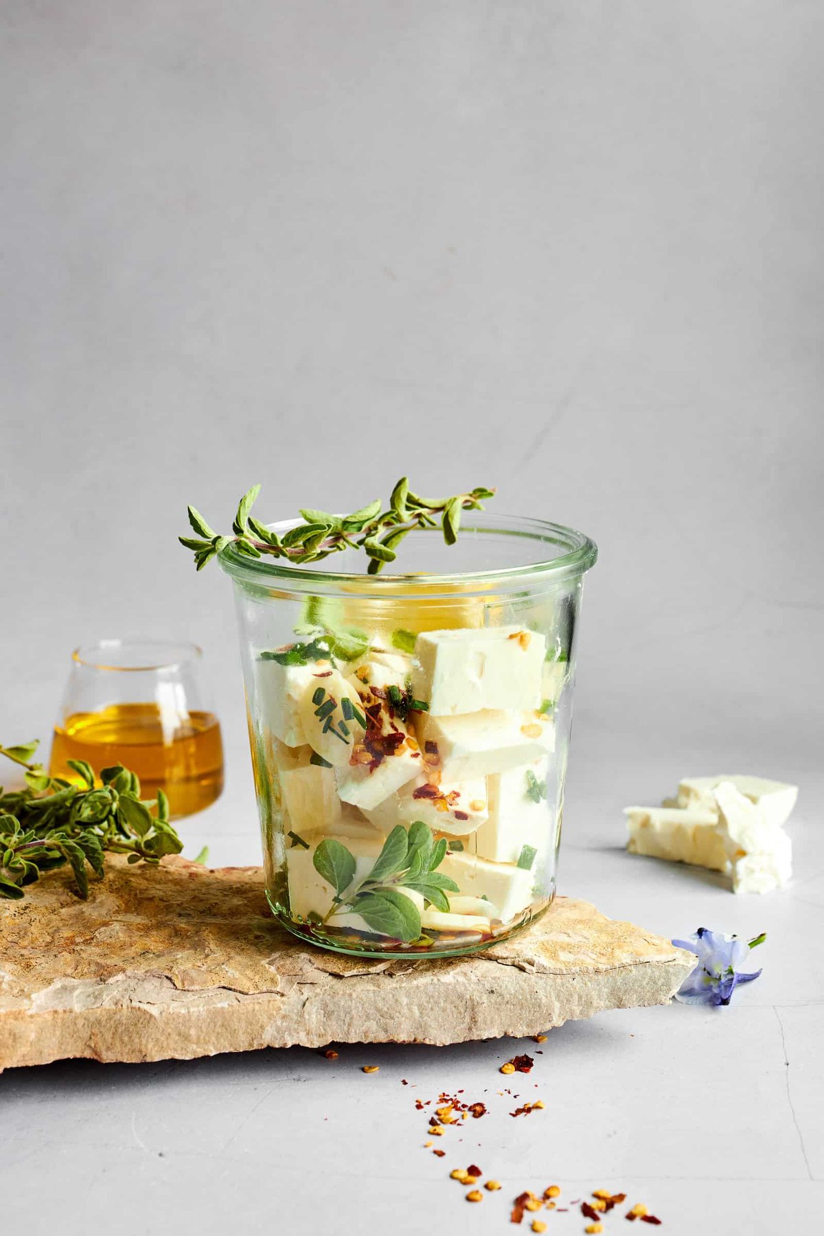 Feta cubes in a glass jar.