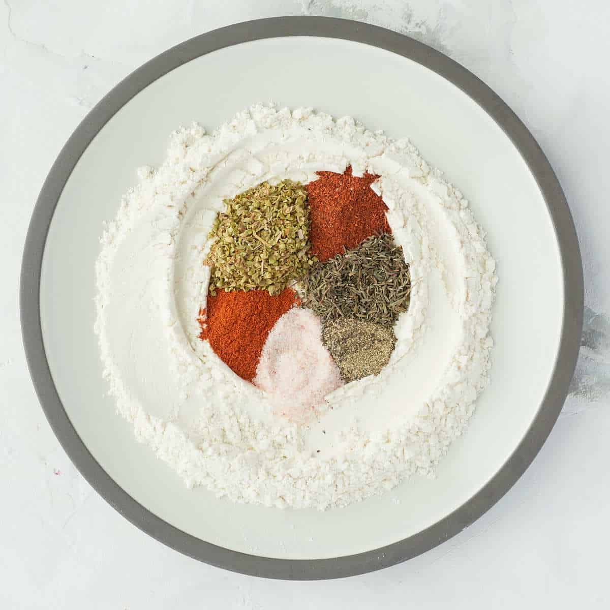 Flour and spices in a bowl.