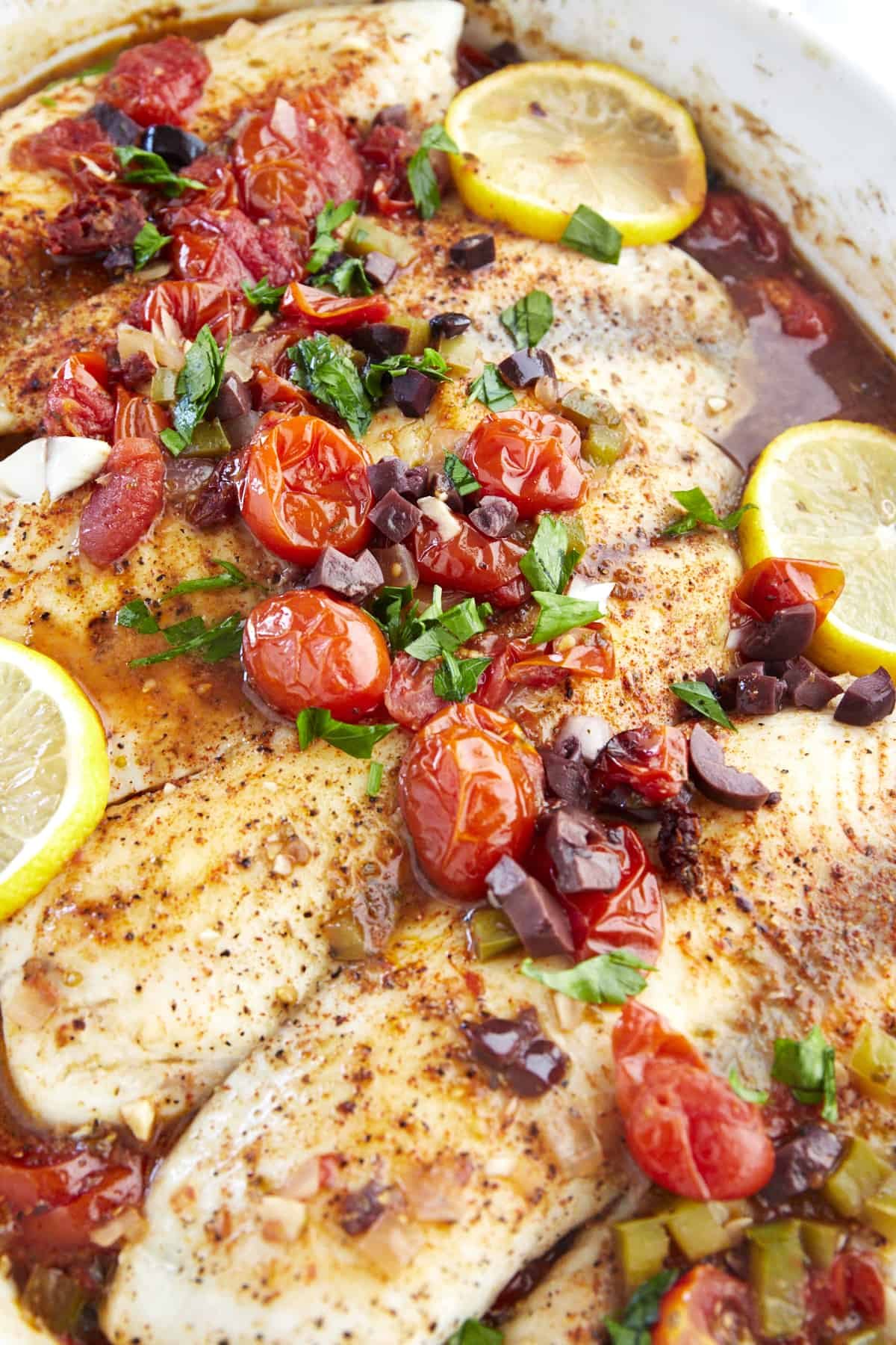 Close up image of baked Mediterranean tilapia.