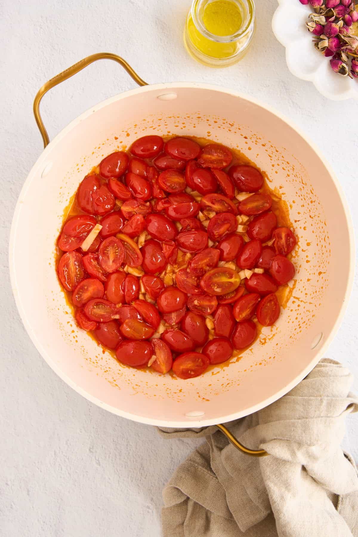 Sautéed tomatoes and garlic in a pasta pot.