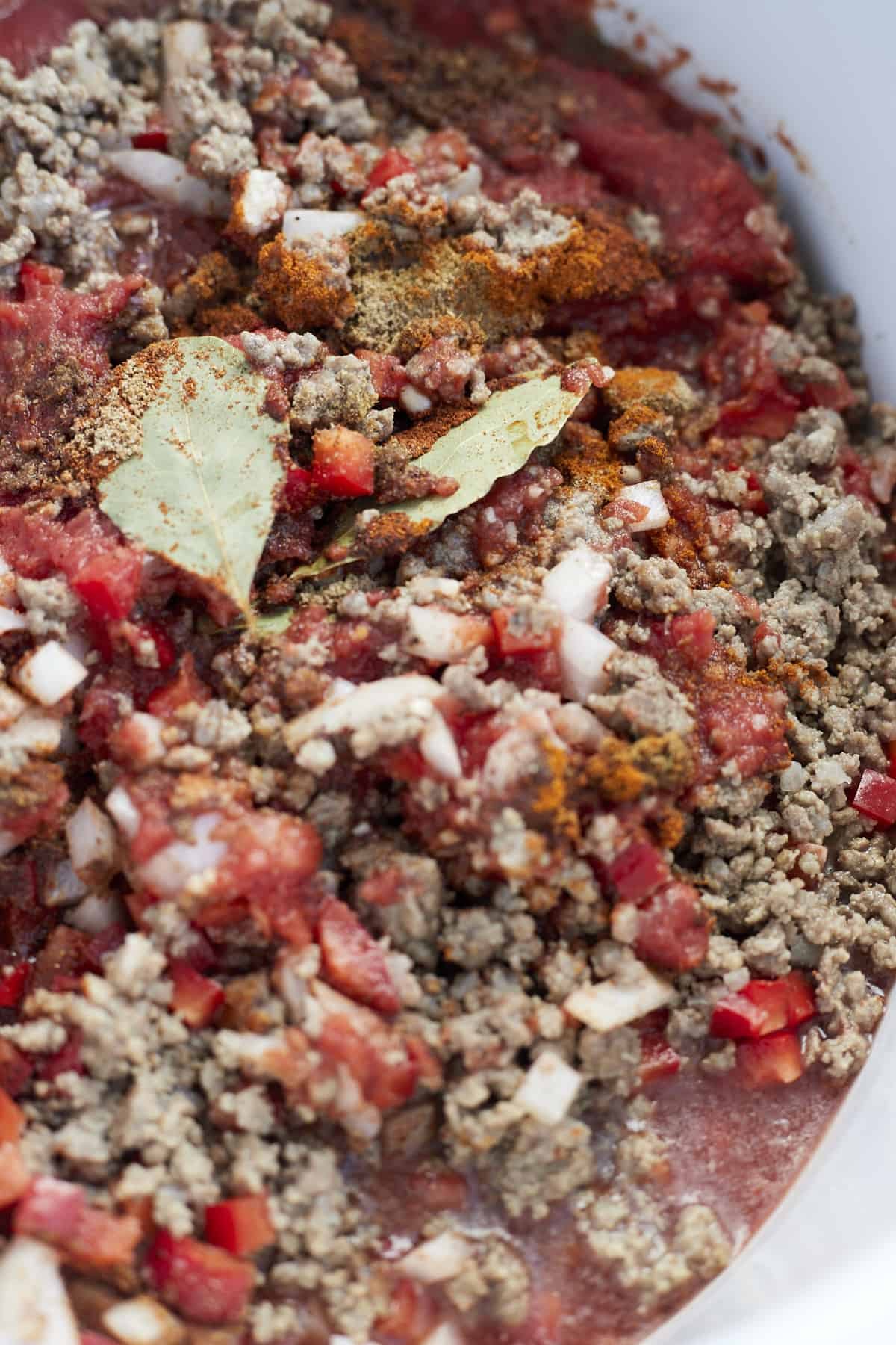 close up image of a beef mixture in a slow cooker