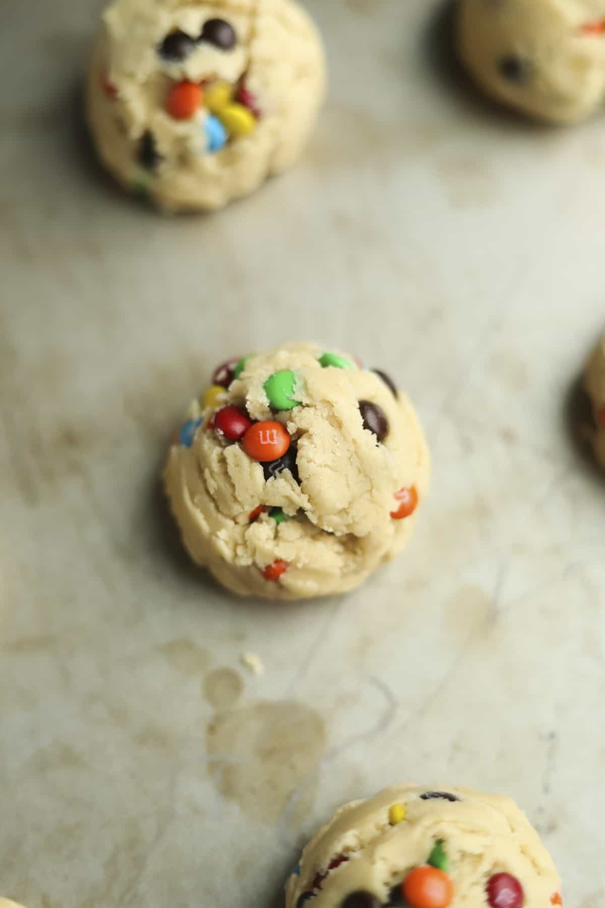 one cookie dough ball on a baking sheet