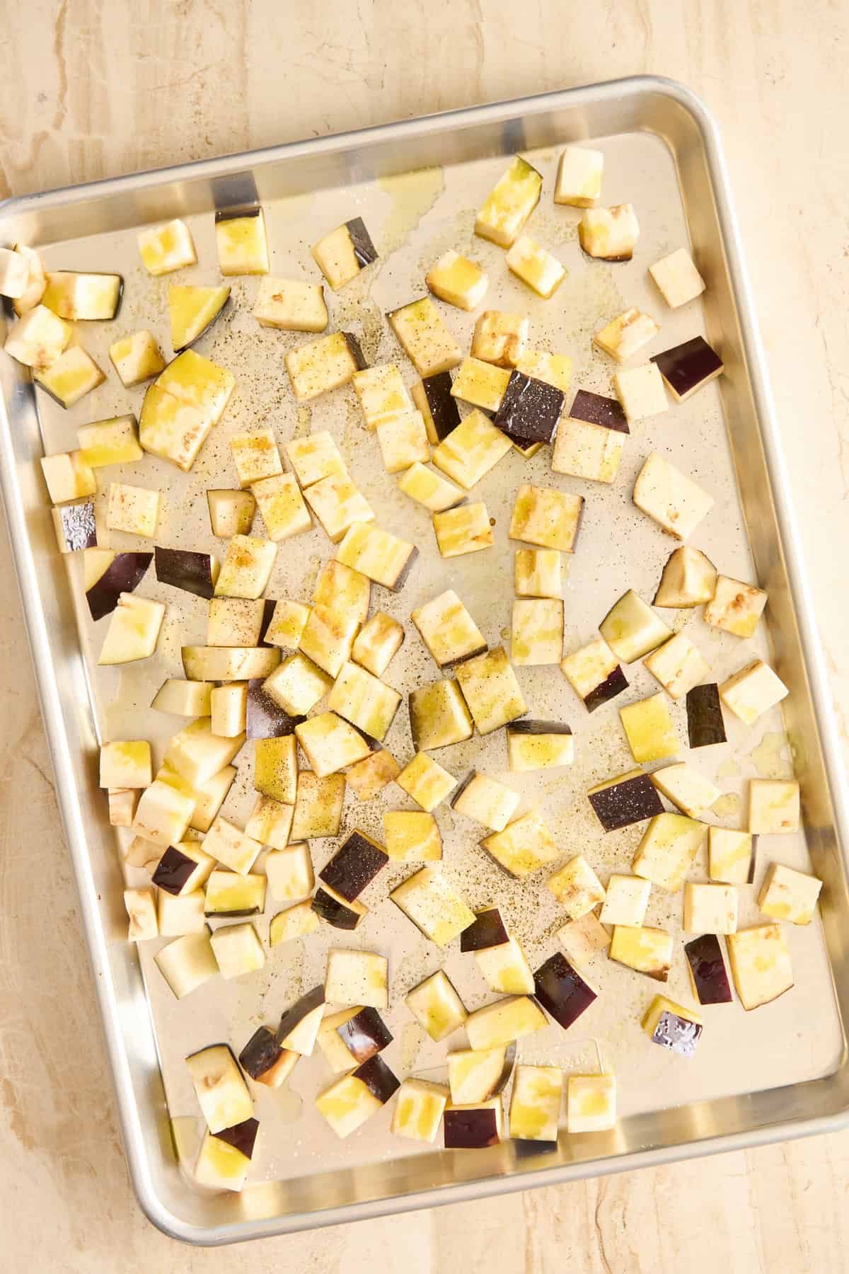 diced eggplant on a baking sheet