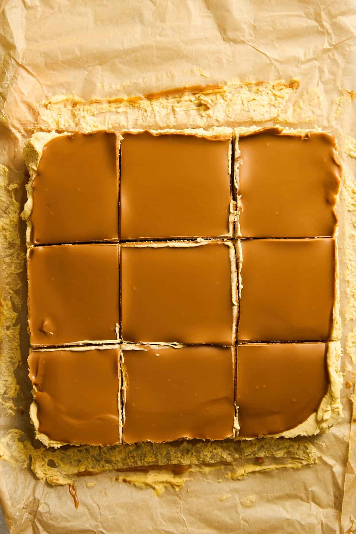 No-bake pumpkin cheesecake bars sliced into nine pieces.