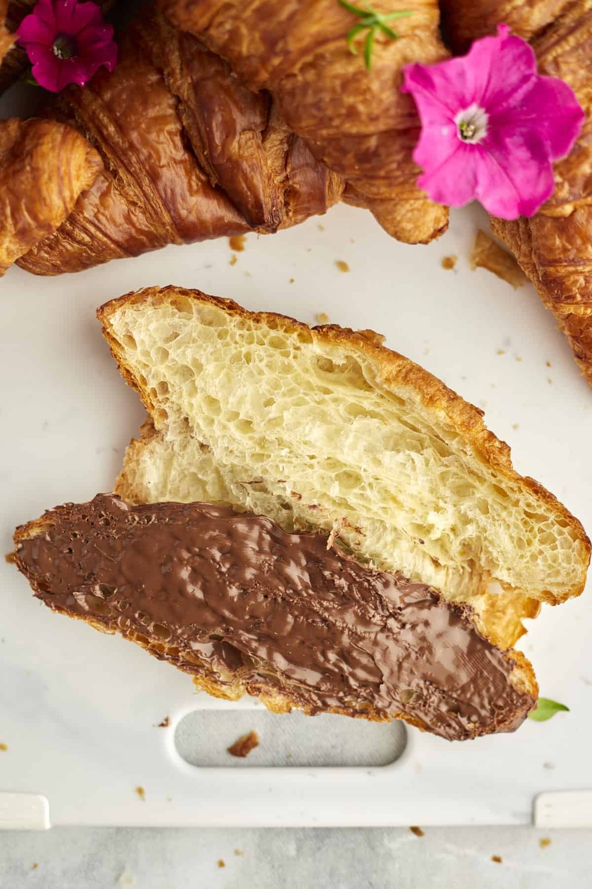 a large croissant sliced in half