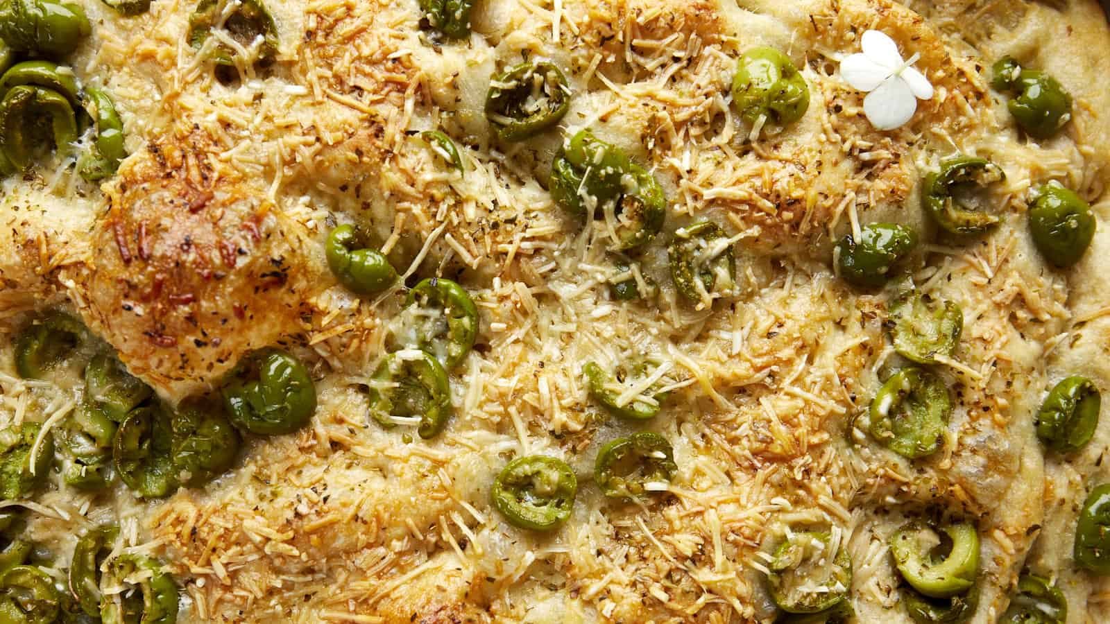 Close up image of olive focaccia bread.