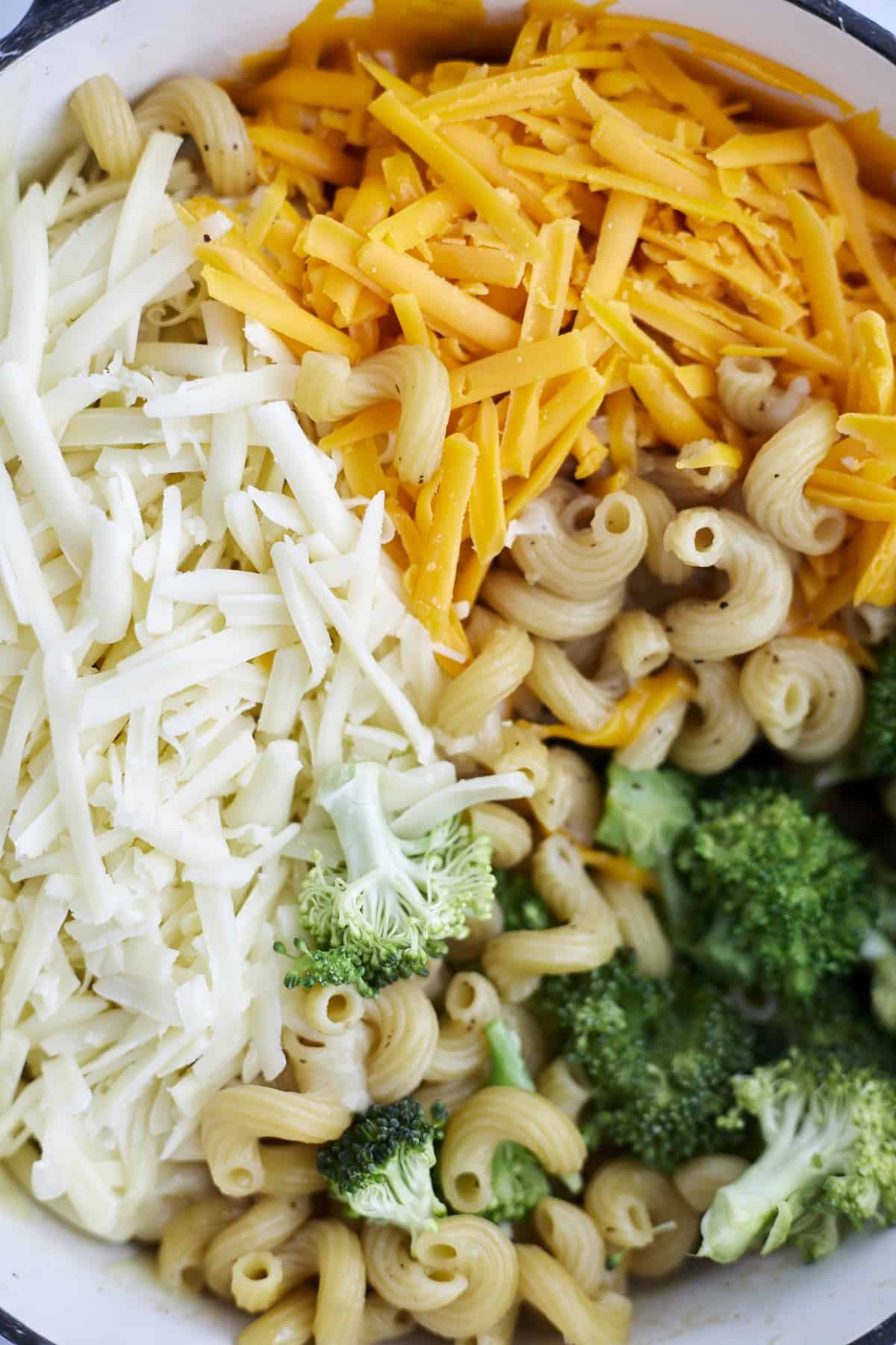 close up image of cavatappi noodles, broccoli and cheddar