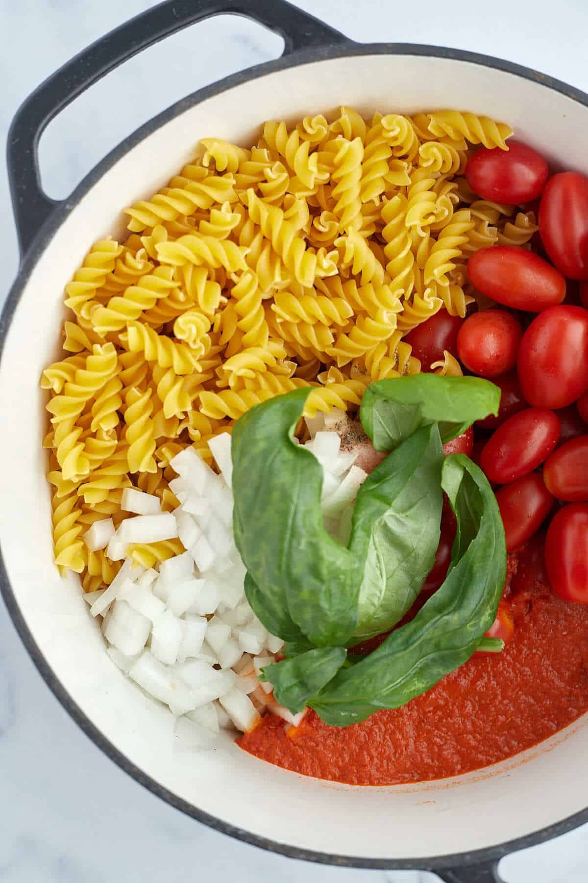 overhead of one pot caprese pasta in a pot