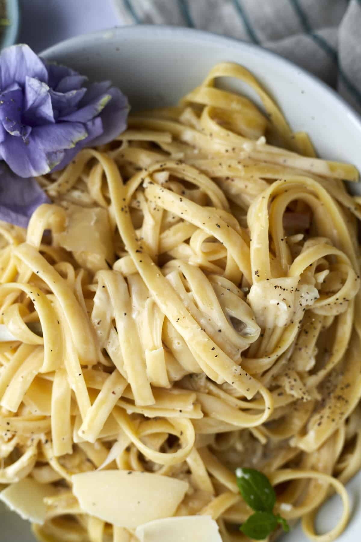 Close up image of one pot fettuccine alfredo in a bowl.