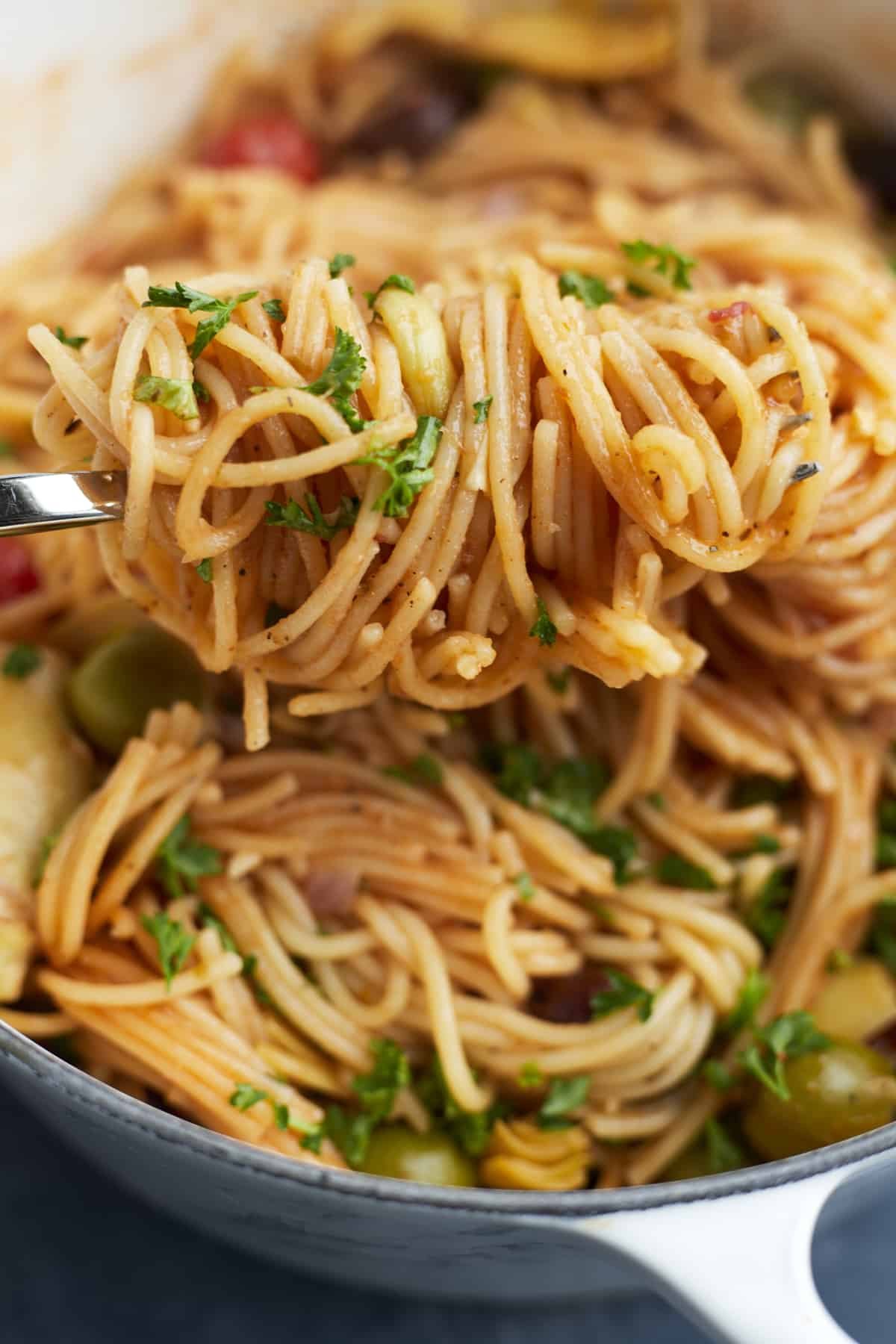 one pot Greek spaghetti twirled on a fork