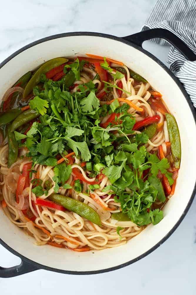 Overhead image of a bowl of vegetarian ramen topped with fresh cilantro.