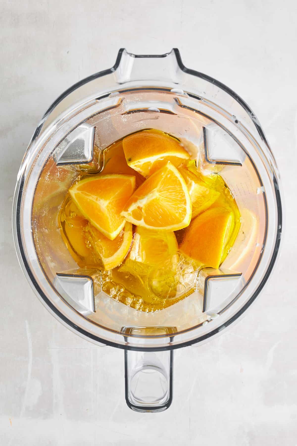 Liquid ingredients for orange cake in a blender.