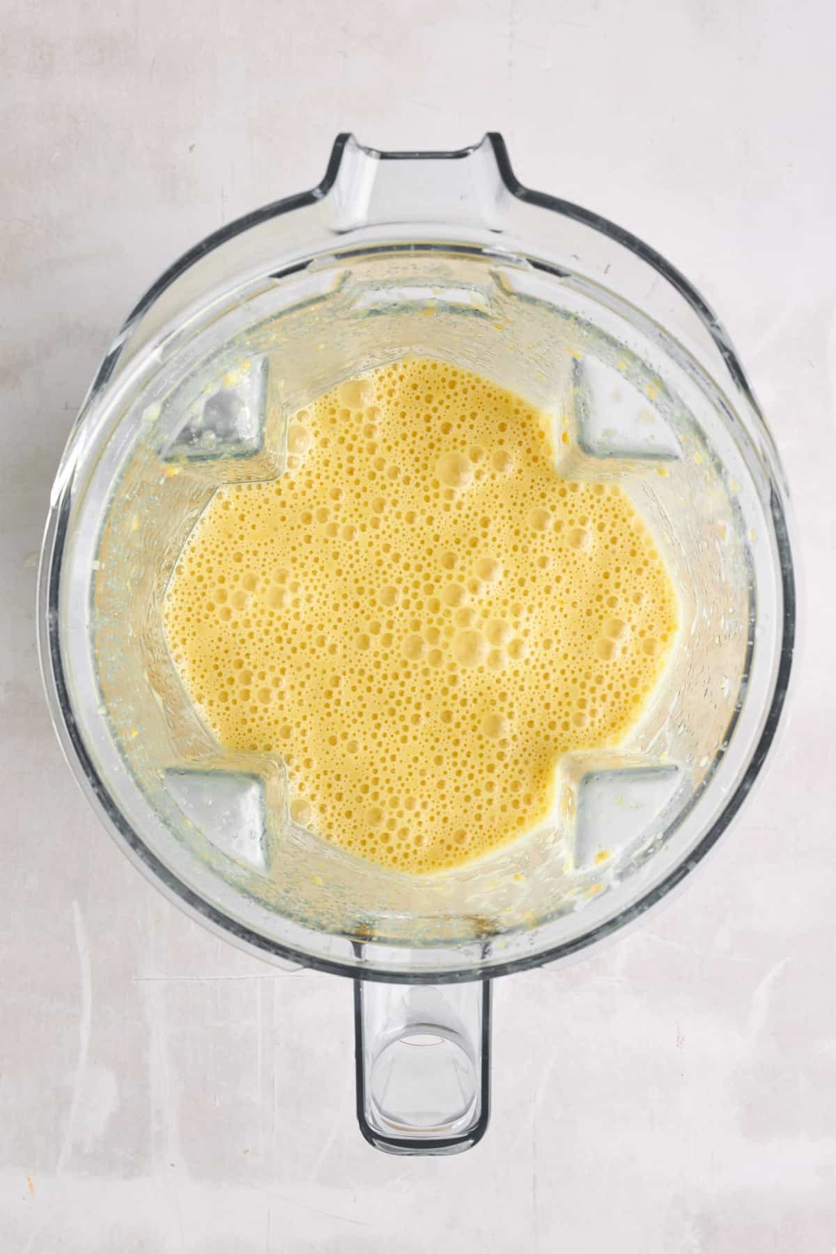 Blended orange cake ingredients.