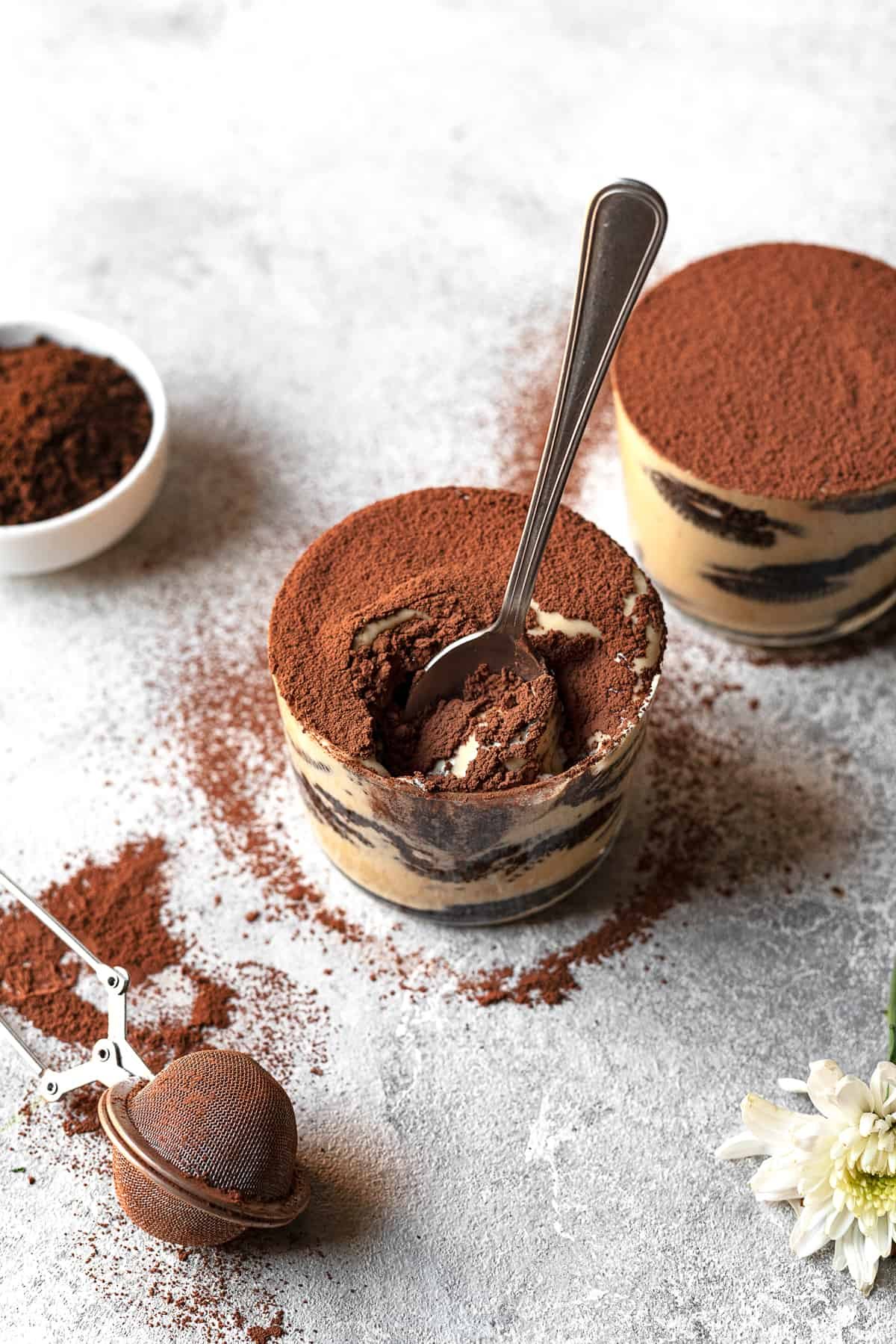a spoon dipping into a jar of Oreo tiramisu