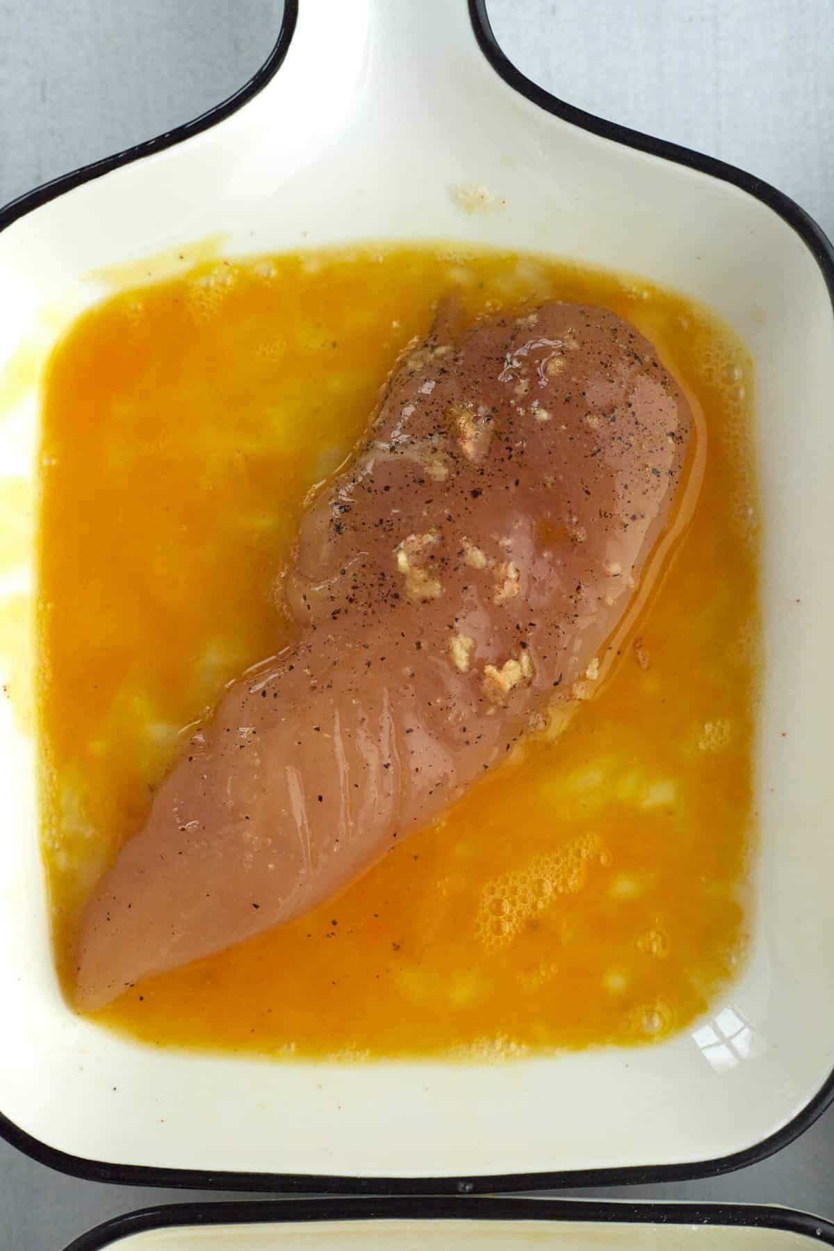 chicken being dipped in egg