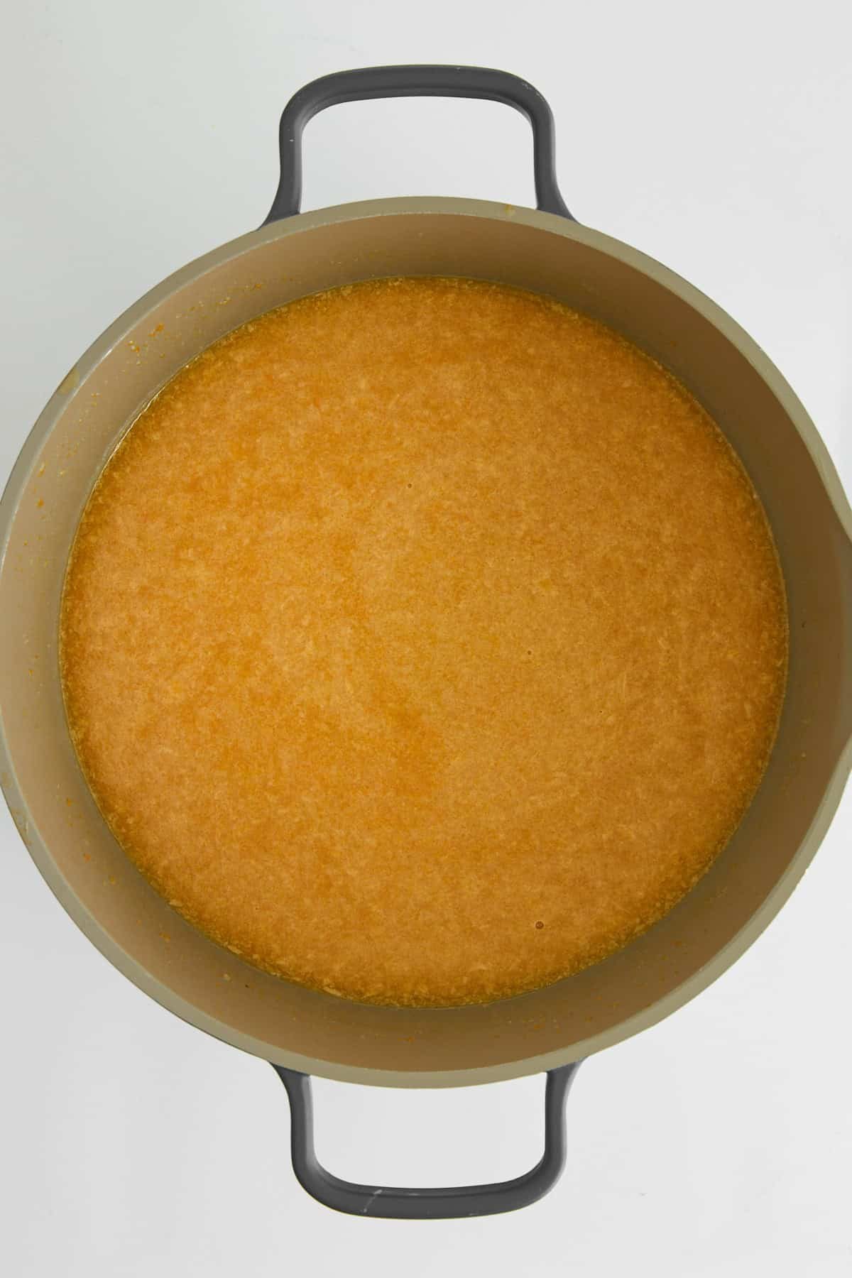 A pot of pastina soup broth.